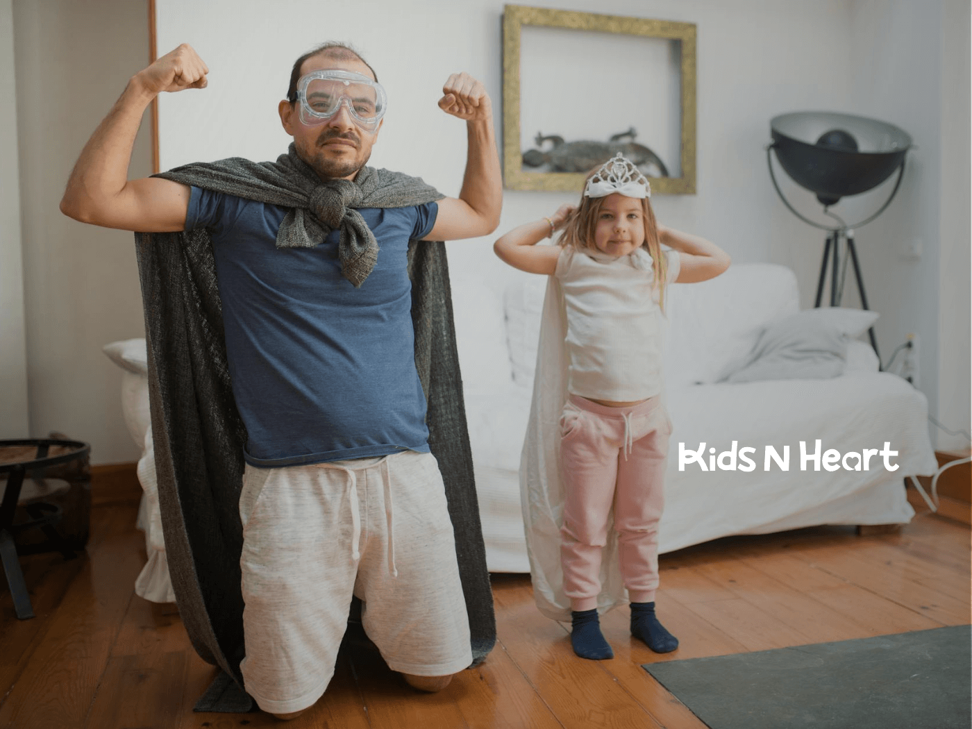 Father and autistic daughter dressed as superheroes posing together during in-home ABA therapy in North Carolina.