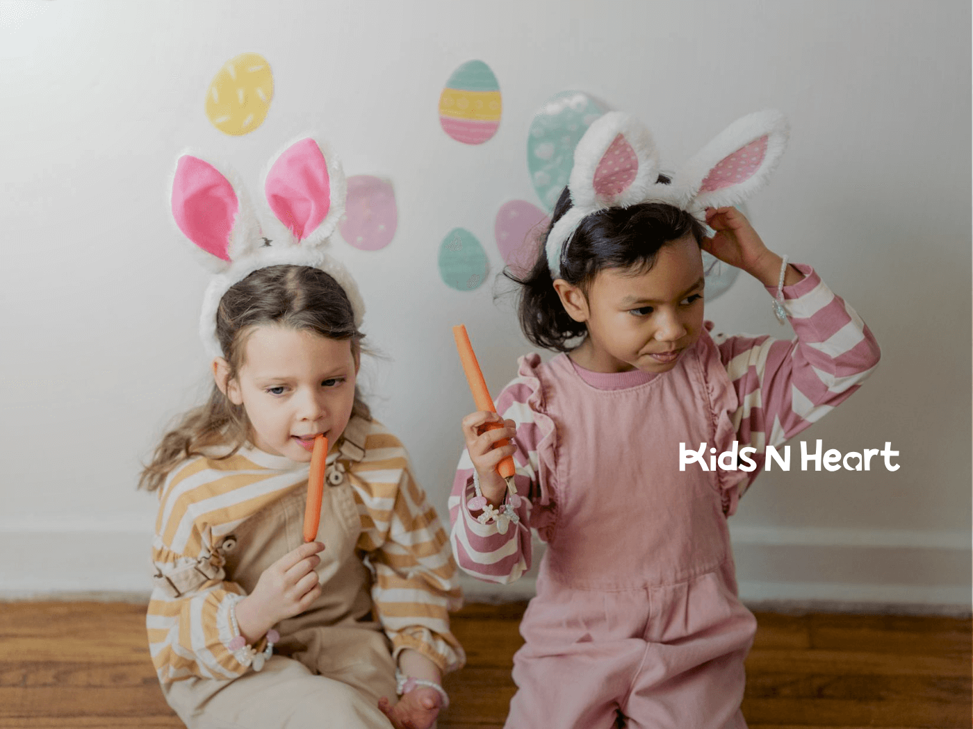 Two autistic girls wearing bunny ears are eating carrots during an in-home ABA therapy session in North Carolina.