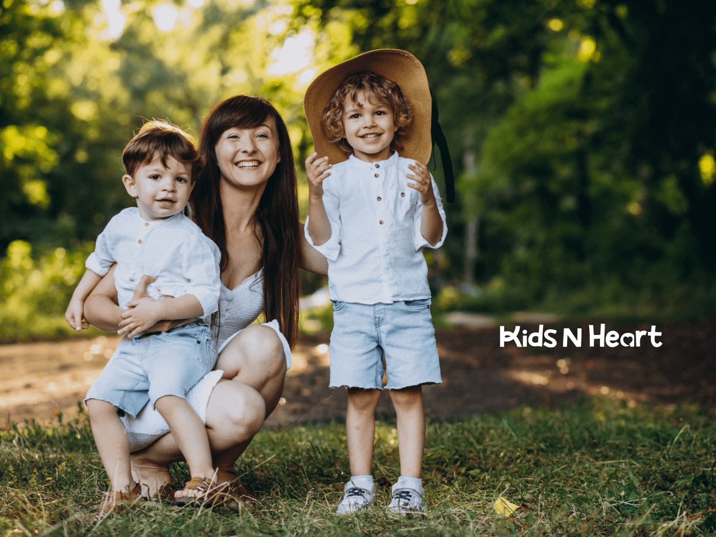 Autistic teenage girl with two autistic children smiling for a photo outdoors, while the teenage girl holding them together
