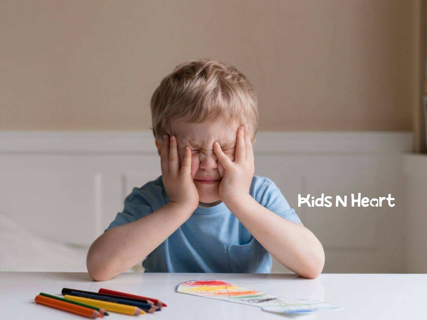 Child with autism showing frustration during ABA therapy activity.