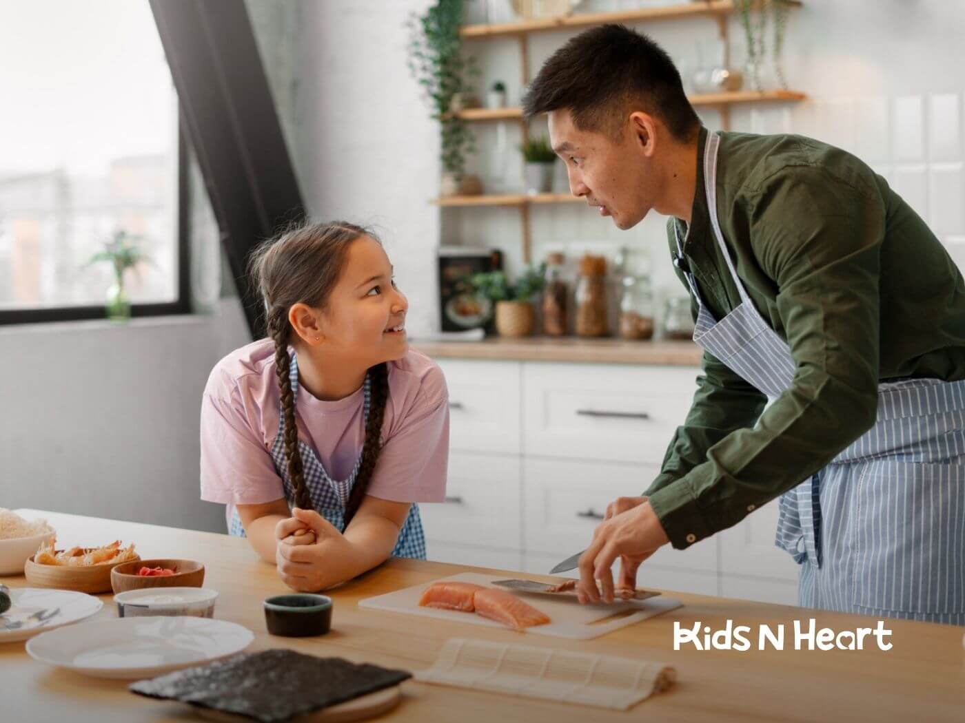 BCBA and child cooking together in a bright kitchen, preparing food at a counter.
